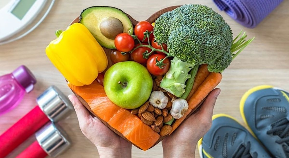 A picture of halthy food arranged in the shape of a heart.